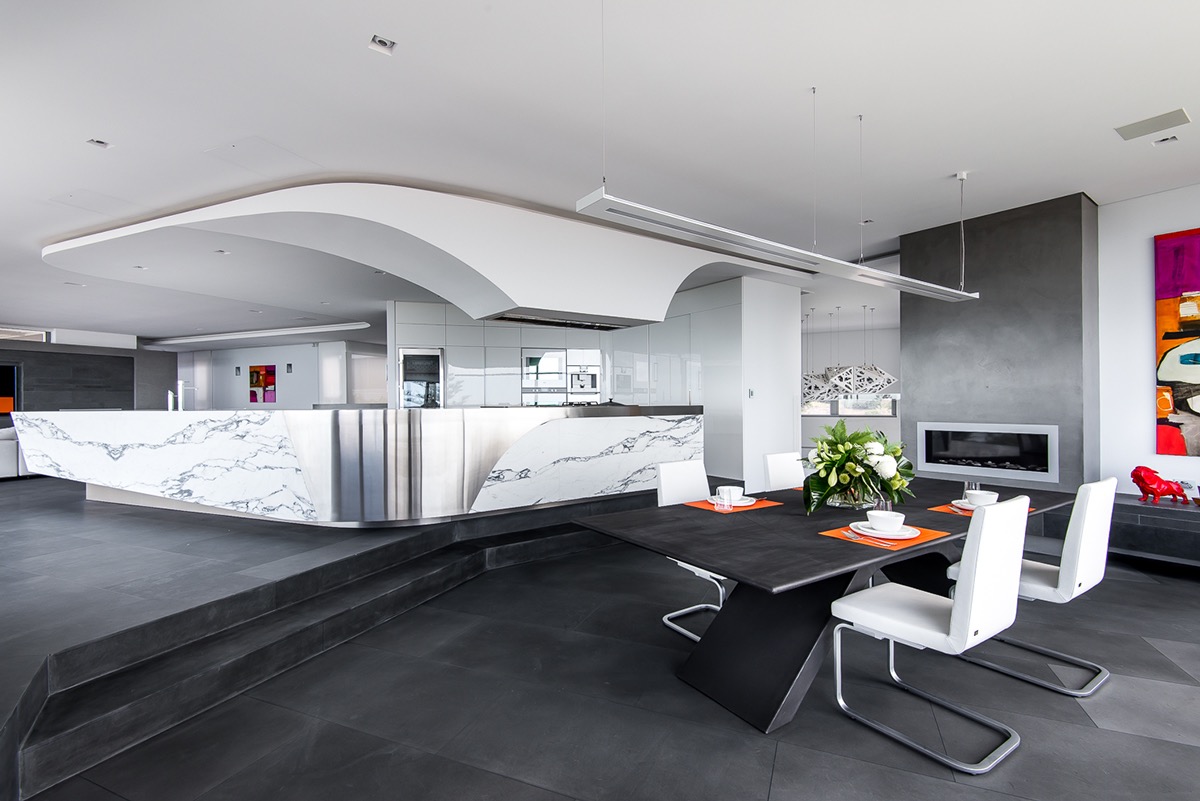 curved-ceiling-leather-chairs-dining-room-black-and-white