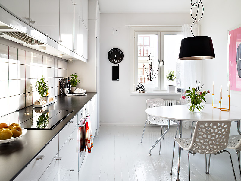 white kitchen and dining design 