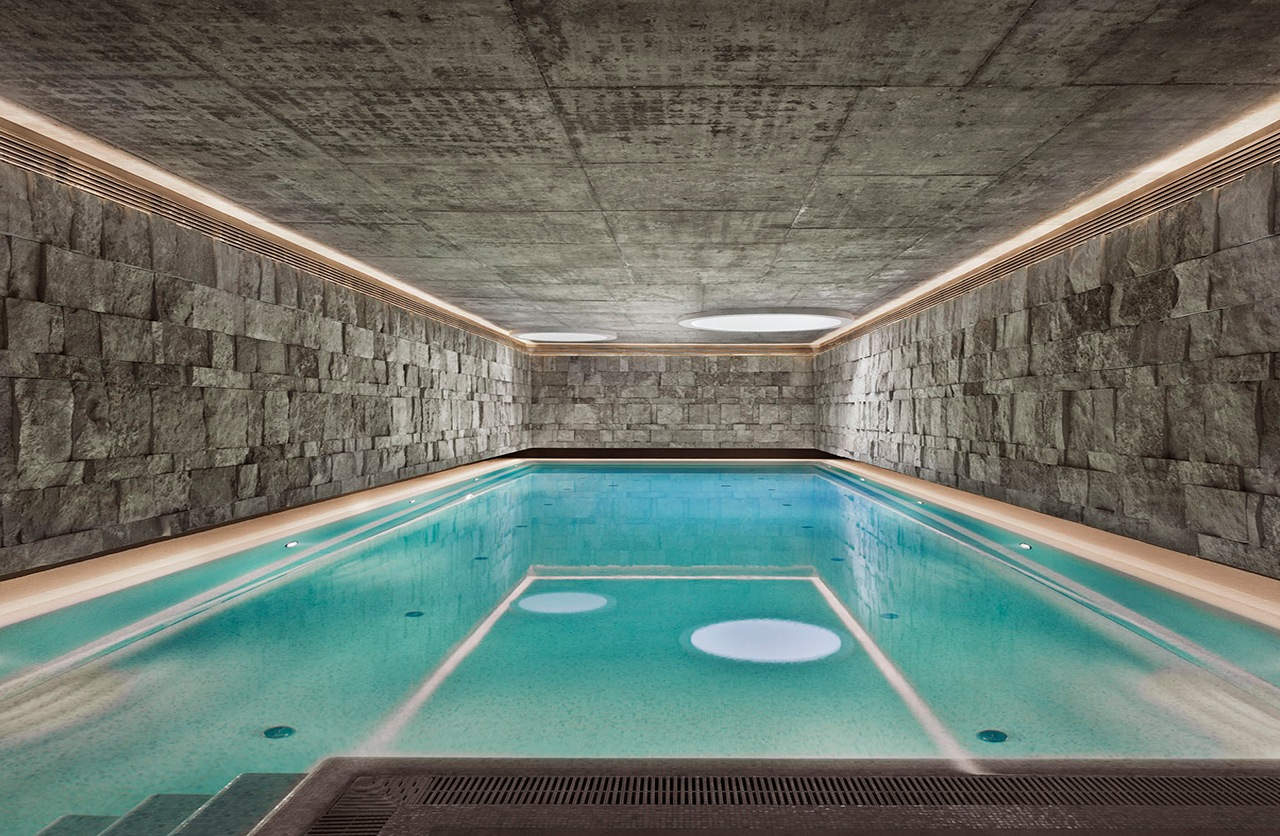 Indoor swimming pool with stone decoration