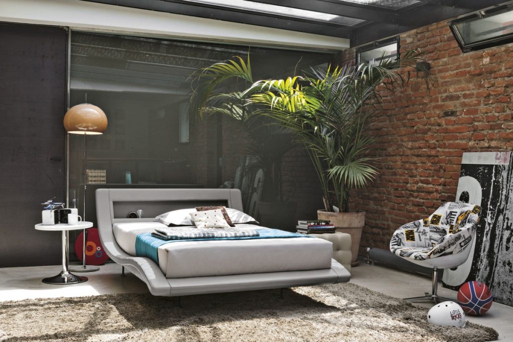 lush-jungle-bedroom-with-exposed-brick