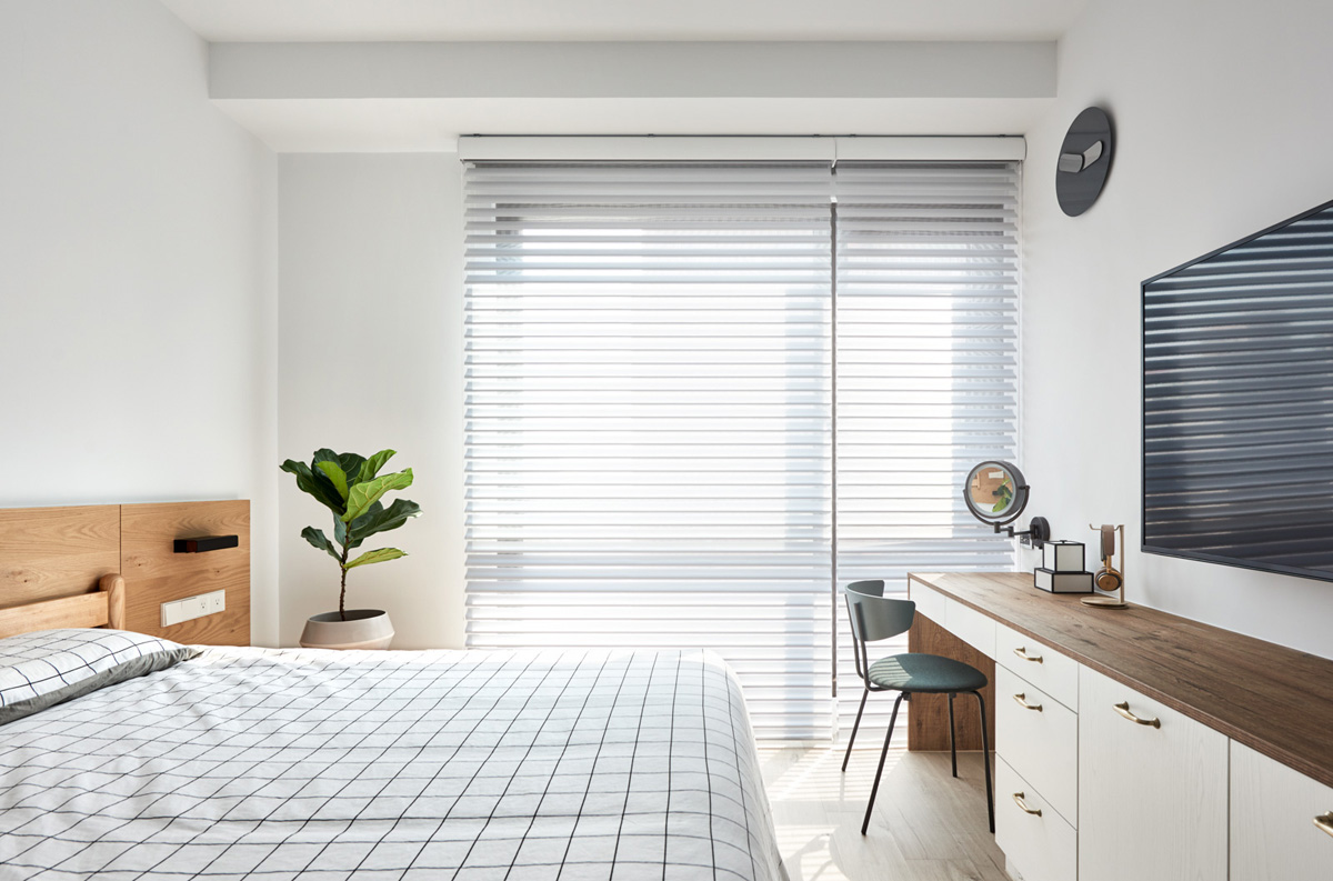 white bedroom with blinds