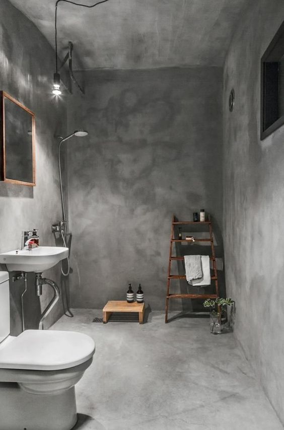 industrial bathroom with concrete ceiling