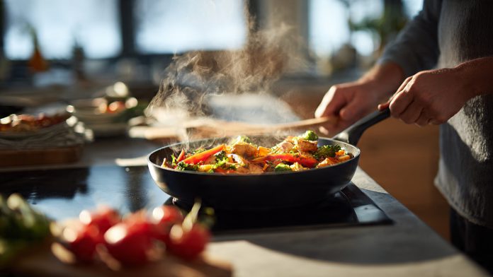 modern_home_kitchen_scene_a_cook_using